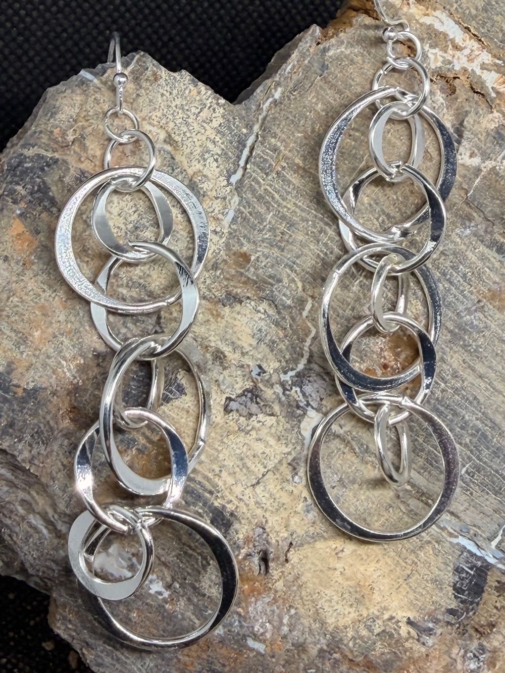 Modern cascading interlocking loops silver tone long trending earrings